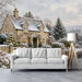 A quiet home cinema corner featuring the snowy English landscape mural as an expansive, calming backdrop.