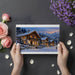 Winter landscape wallpaper behind a wooden dining table in an alpine home