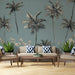Tropical-themed room with palm tree wallpaper, beige sofa, and decorative pillows.