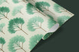 Green leaf patterned paper on a dark background