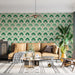 Living room with a beige sofa, patterned wallpaper, and decorative plants.