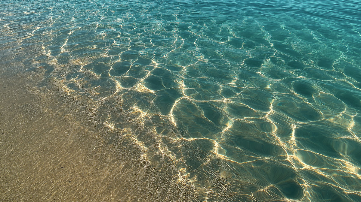 Sunlit Shallows Water Texture Mural Wallpaper | Turquoise Ocean, Golden Sand, Rippling Light Pattern