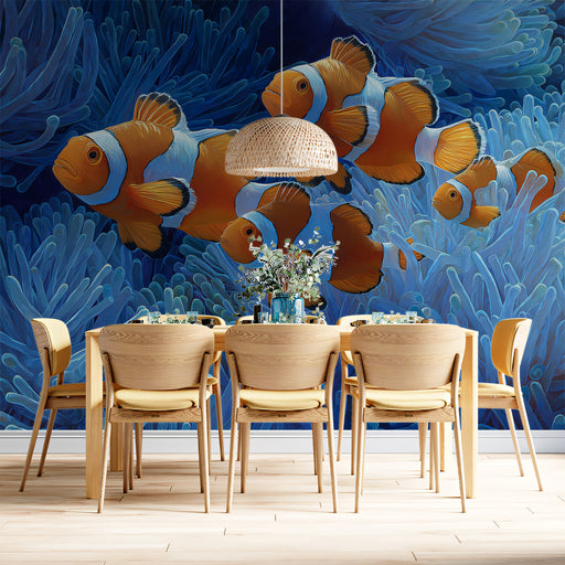 Dining area with wooden chairs and table against an underwater-themed wall mural featuring clownfish and coral.