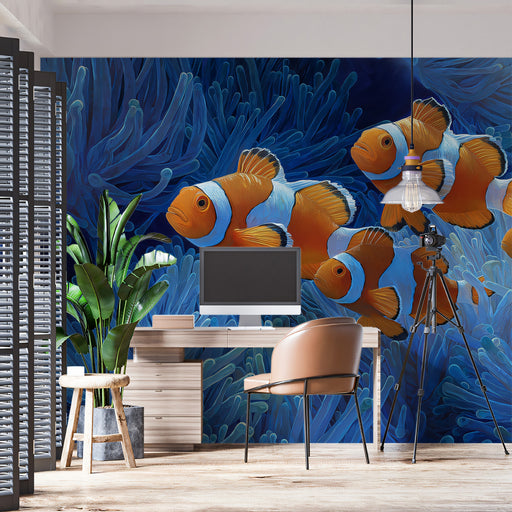 Wall mural of clownfish and coral with a desk and chair in front