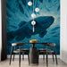 Dining room with a large fish mural on the wall, black table, and chairs.