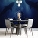 Dining room with shark-themed wall mural and modern furniture.