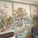 Customer photo: Enchanted Woodland Picnic mural installed in a nursery with green panelling